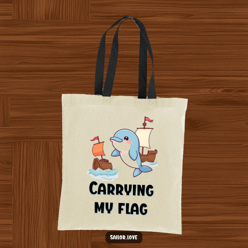 Funny tote bag with a playful dolphin leaping near a waving flag and a tiny ship, ideal for carrying items with a nautical theme.